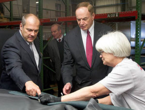 U.S. Senator Richard Shelby (R-Ala.) looks at a piece of leather with Eissmann Automotive North America’s Managing Director Jost Bierbaum, left, and Eissmann leather inspector Francis Tipton, who looks over the hides for flaws. Photo: Brian Schoenhals/The Daily Home